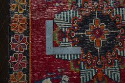 Backside of handmade 2000s Shiraz rug showing knot structure and weave density