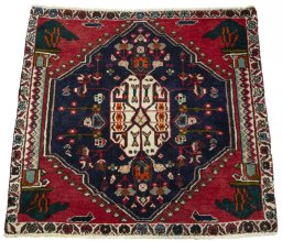 Surface texture of 2000s Shiraz rug with natural Wool and intricate pattern