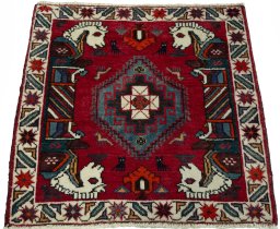 Surface texture of 2000s Shiraz rug with natural Wool and intricate pattern