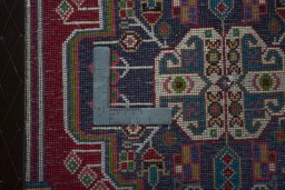 Backside of handmade 2000s Shiraz rug showing knot structure and weave density