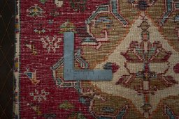 Backside of handmade 2000s Shiraz rug showing knot structure and weave density