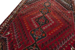 Backside of handmade 2000s Shiraz rug showing knot structure and weave density