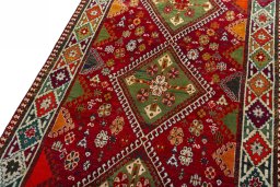 Backside of handmade 2000s Shiraz rug showing knot structure and weave density