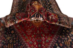 Corner detail of 2000s Shiraz rug showing border pattern and Wool pile