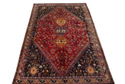 Surface texture of 2000s Shiraz rug with natural Wool and intricate pattern