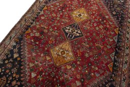 Backside of handmade 2000s Shiraz rug showing knot structure and weave density