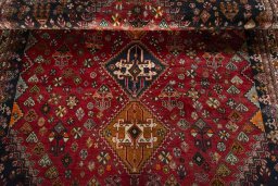 Full view of 2000s Shiraz rug from Iran / Persia, 278 × 176 cm in Red tones
