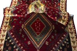 Corner detail of 2000s Shiraz rug showing border pattern and Wool pile