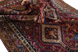 Corner detail of 2000s Shiraz rug showing border pattern and Wool pile