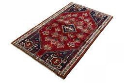 Corner detail of 2000s Shiraz rug showing border pattern and Wool pile