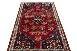 Surface texture of 2000s Shiraz rug with natural Wool and intricate pattern