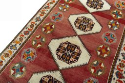 Backside of handmade 2000s Shiraz rug showing knot structure and weave density