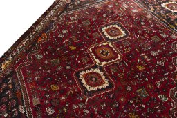 Backside of handmade 2000s Shiraz rug showing knot structure and weave density