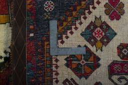Surface texture of 2000s Shiraz rug with natural Wool and intricate pattern