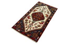 Corner detail of 2000s Shiraz rug showing border pattern and Wool pile