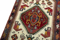 Backside of handmade 2000s Shiraz rug showing knot structure and weave density