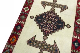 Backside of handmade 2000s Shiraz rug showing knot structure and weave density