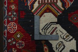 Backside of handmade 2000s Shiraz rug showing knot structure and weave density