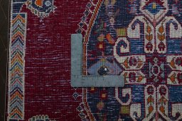 Backside of handmade 2000s Shiraz rug showing knot structure and weave density