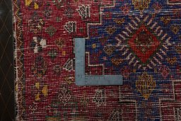 Backside of handmade 2000s Shiraz rug showing knot structure and weave density