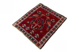 Corner detail of 2000s Shiraz rug showing border pattern and Wool pile
