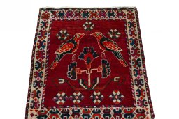 Surface texture of 2000s Shiraz rug with natural Wool and intricate pattern