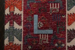 Backside of handmade 2000s Shiraz rug showing knot structure and weave density