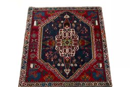 Surface texture of 2000s Shiraz rug with natural Wool and intricate pattern