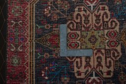 Backside of handmade 2000s Shiraz rug showing knot structure and weave density
