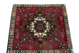 Surface texture of 2000s Shiraz rug with natural Wool and intricate pattern