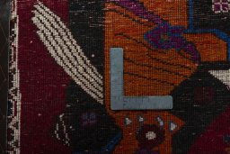 Backside of handmade 2000s Shiraz rug showing knot structure and weave density
