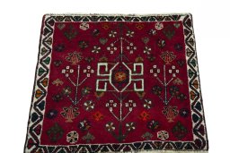 Surface texture of 2000s Shiraz rug with natural Wool and intricate pattern