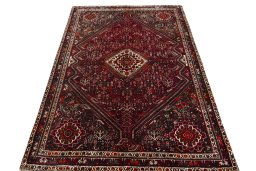 Surface texture of 2000s Shiraz rug with natural Wool and intricate pattern