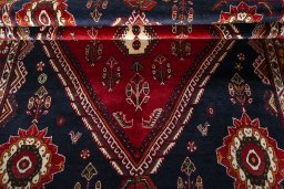 Corner detail of 2000s Shiraz rug showing border pattern and Wool pile