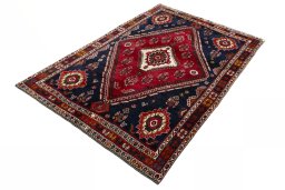Corner detail of 2000s Shiraz rug showing border pattern and Wool pile