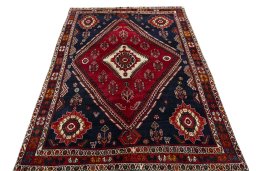 Surface texture of 2000s Shiraz rug with natural Wool and intricate pattern