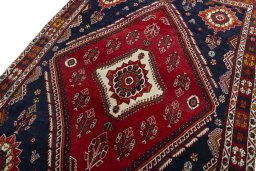 Backside of handmade 2000s Shiraz rug showing knot structure and weave density