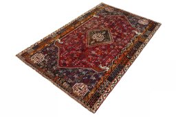 Corner detail of 2000s Shiraz rug showing border pattern and Wool pile