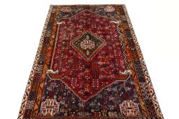 Surface texture of 2000s Shiraz rug with natural Wool and intricate pattern