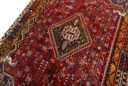 Backside of handmade 2000s Shiraz rug showing knot structure and weave density