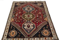 Surface texture of 2000s Shiraz rug with natural Wool and intricate pattern