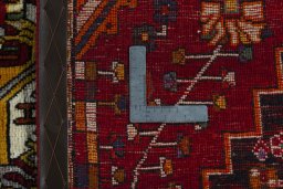 Surface texture of 2000s Shiraz rug with natural Wool and intricate pattern