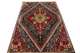Surface texture of 2000s Shiraz rug with natural Wool and intricate pattern