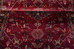 Corner detail of 2000s Shiraz rug showing border pattern and Wool pile
