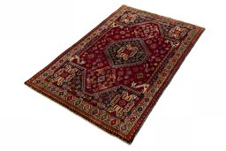 Corner detail of 2000s Shiraz rug showing border pattern and Wool pile