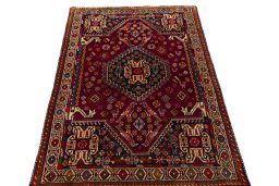 Surface texture of 2000s Shiraz rug with natural Wool and intricate pattern