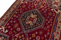 Backside of handmade 2000s Shiraz rug showing knot structure and weave density