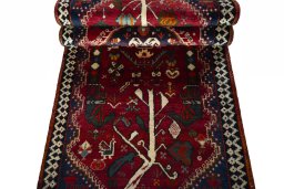 Corner detail of 2000s Shiraz rug showing border pattern and Wool pile