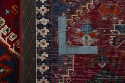 Surface texture of 2000s Shiraz rug with natural Wool and intricate pattern