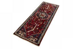 Corner detail of 2000s Shiraz rug showing border pattern and Wool pile